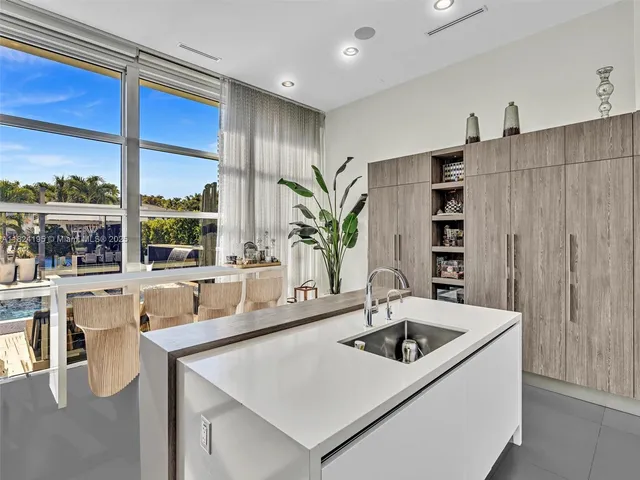 a white toilet sitting next to a bathroom sink and a bath tub