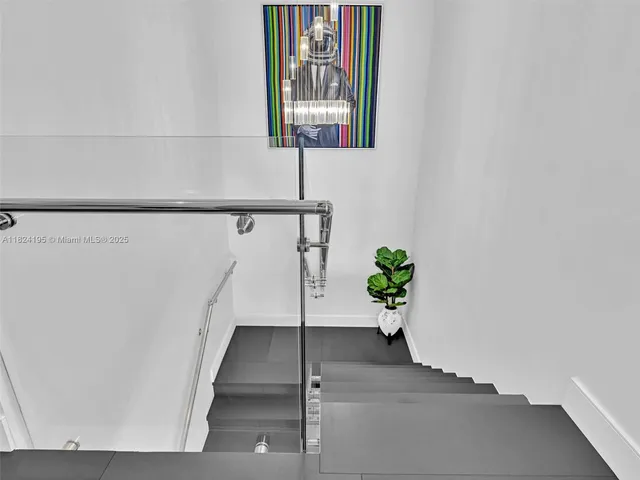 a bathroom with a granite countertop shower a toilet and a sink