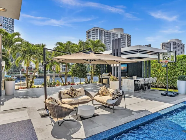 a outdoor space with patio the couches and a dining table with the view of the balcony