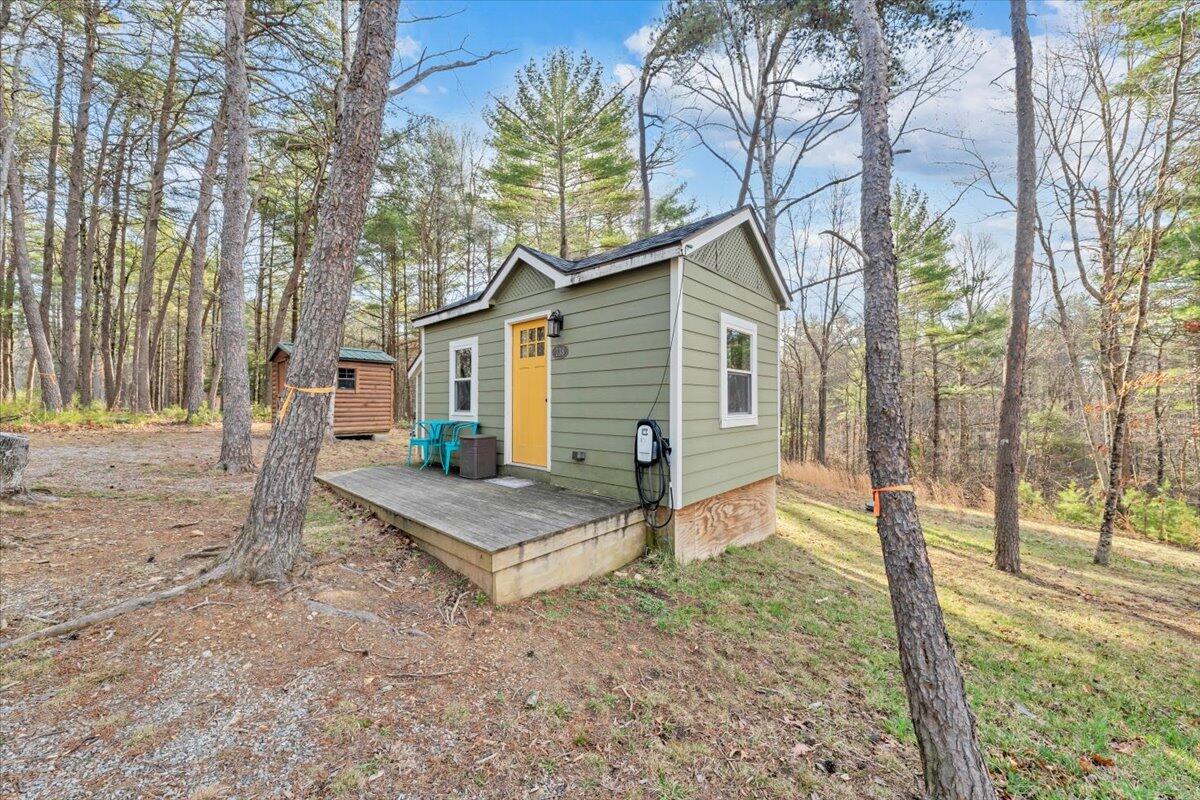 738 Jerry Lane Northeast Check, VA 24072 - Photo 22 of 52 a view of a house with a yard and trees