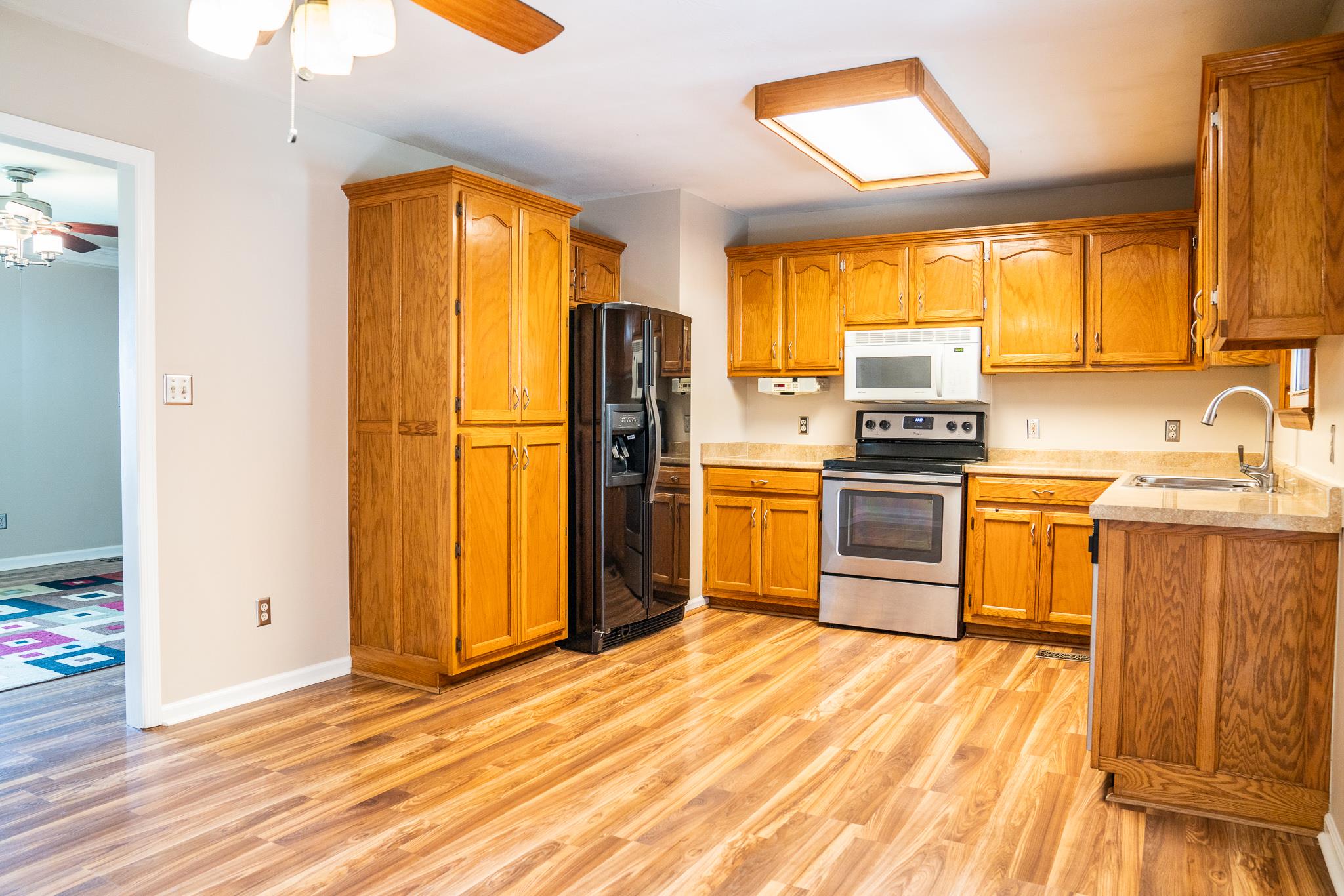 3488 Mahlon Moore Road Spring Hill, TN 37174 - Photo 8 of 28 a kitchen with a sink appliances and cabinets
