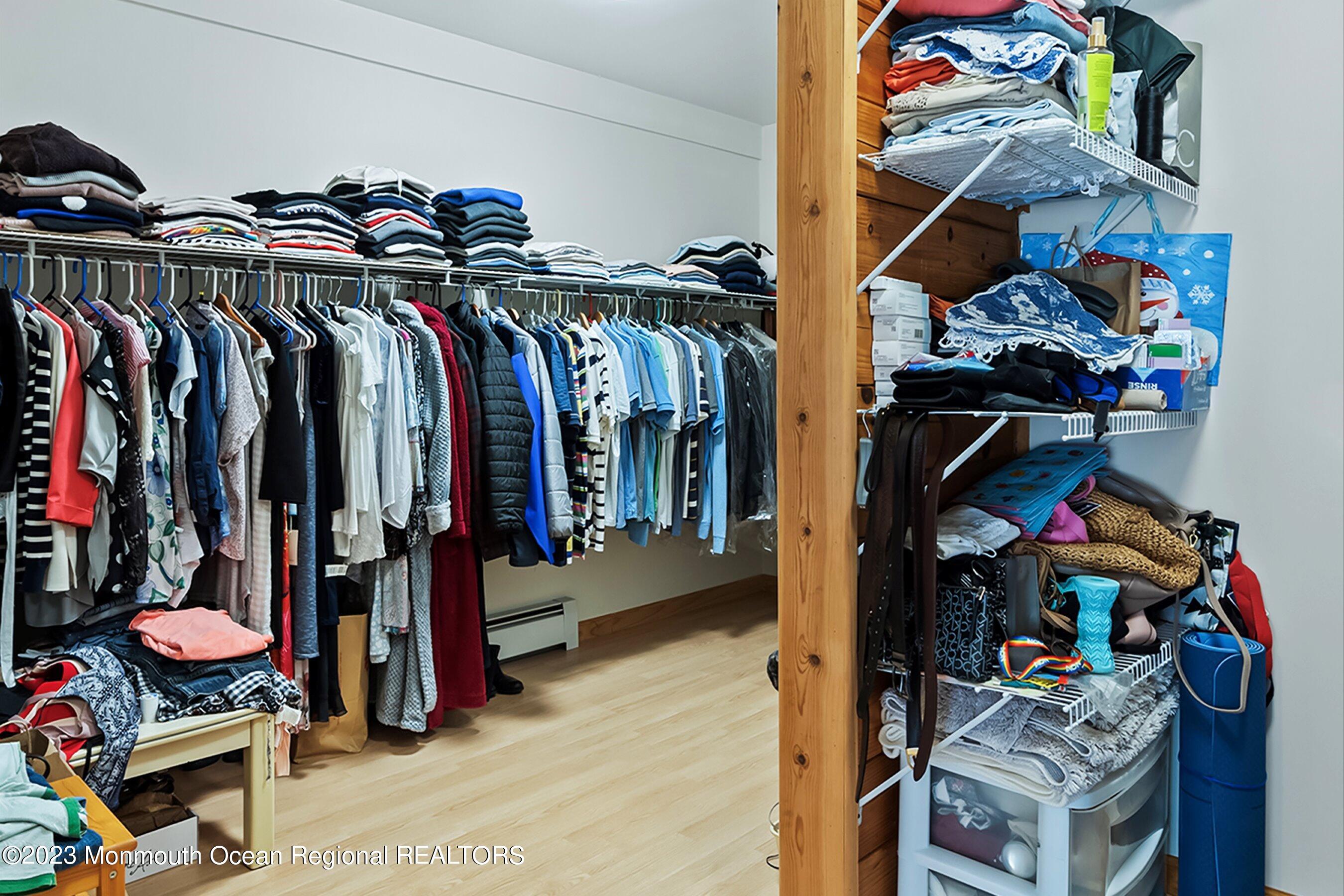 172 Jackson Mills Road Freehold, NJ 07728 - Photo 14 of 20 a view of walk in closet with clothes and shoes