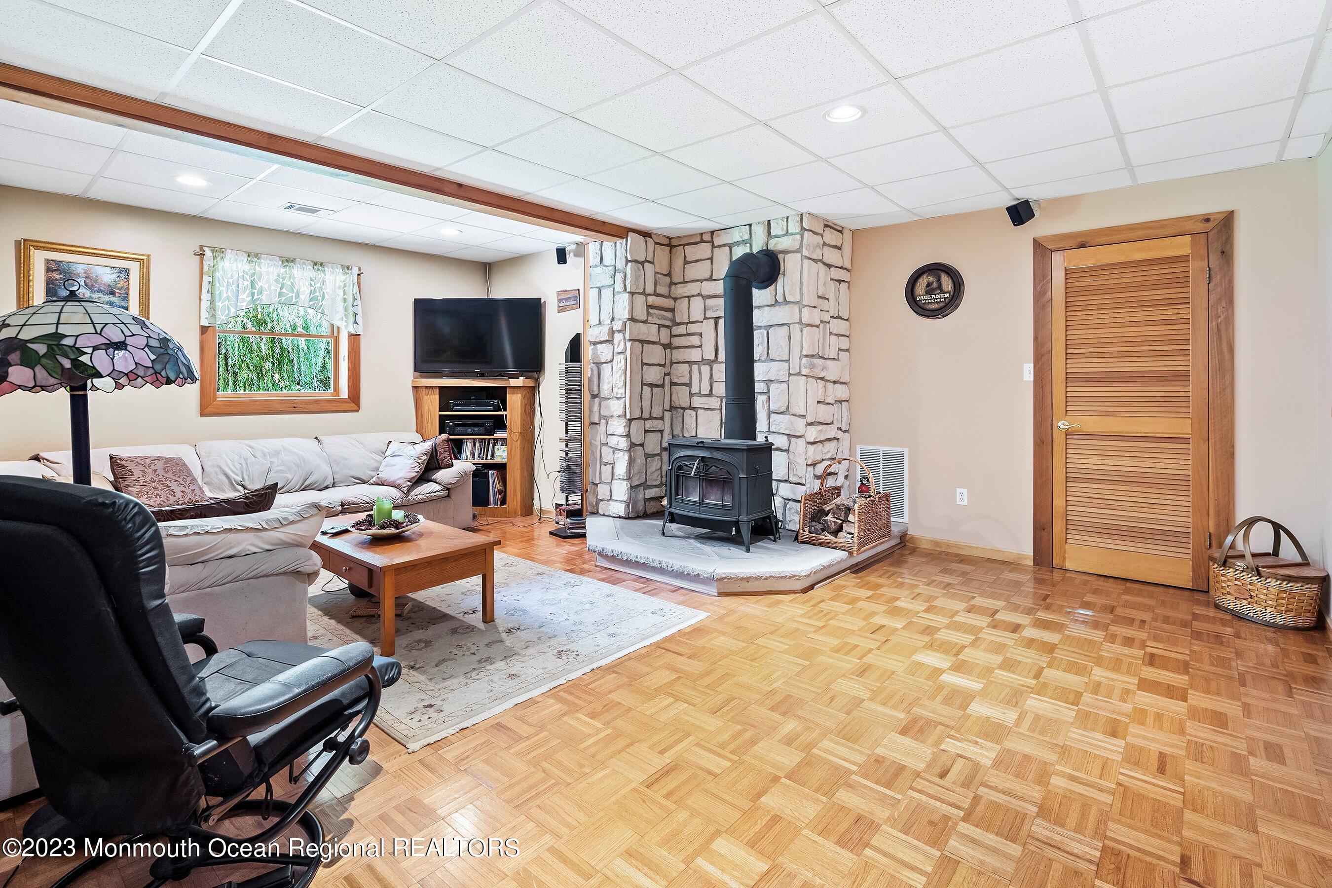 172 Jackson Mills Road Freehold, NJ 07728 - Photo 17 of 20 a living room with furniture and a flat screen tv