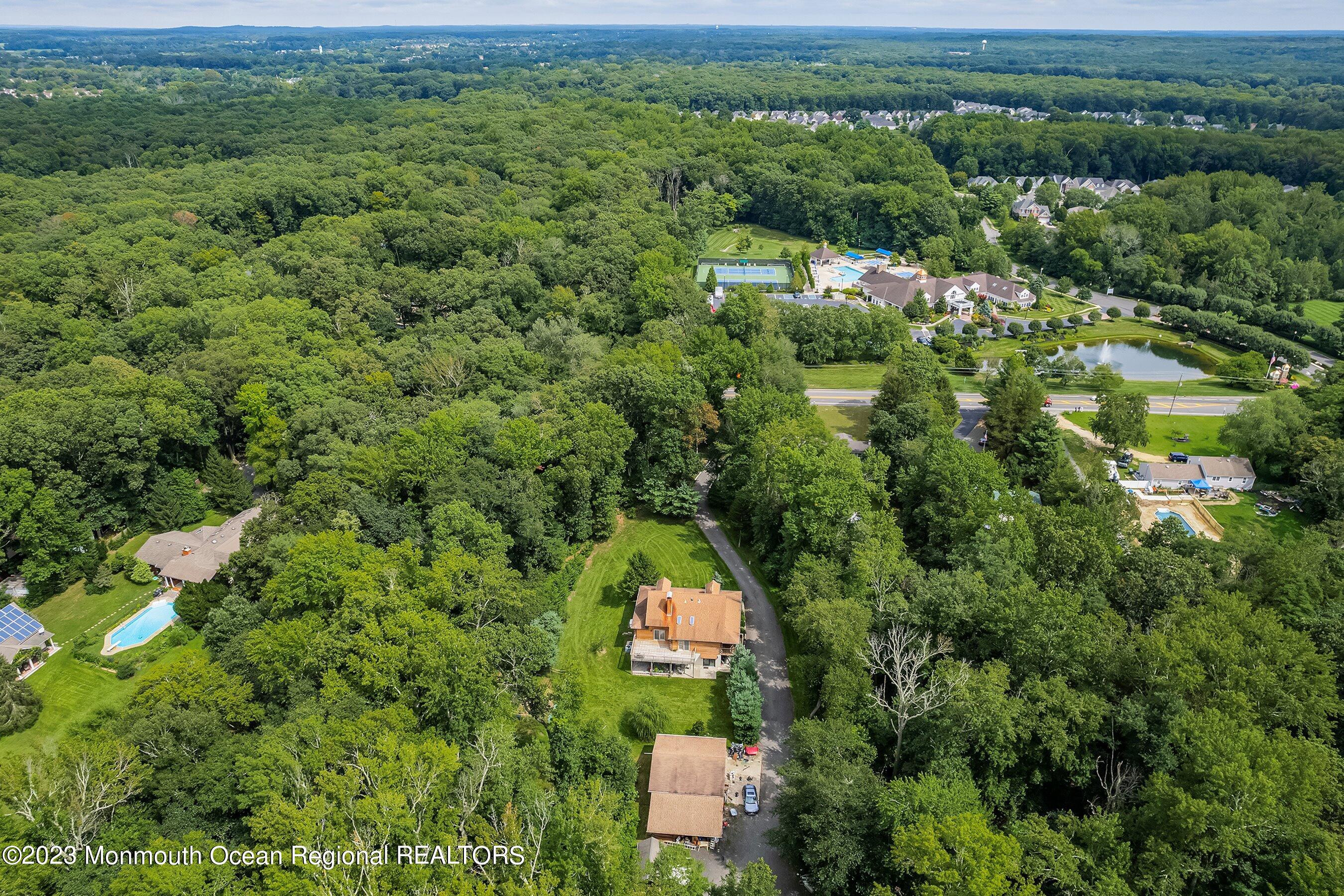 172 Jackson Mills Road Freehold, NJ 07728 - Photo 20 of 20 an aerial view of residential houses with outdoor space and trees