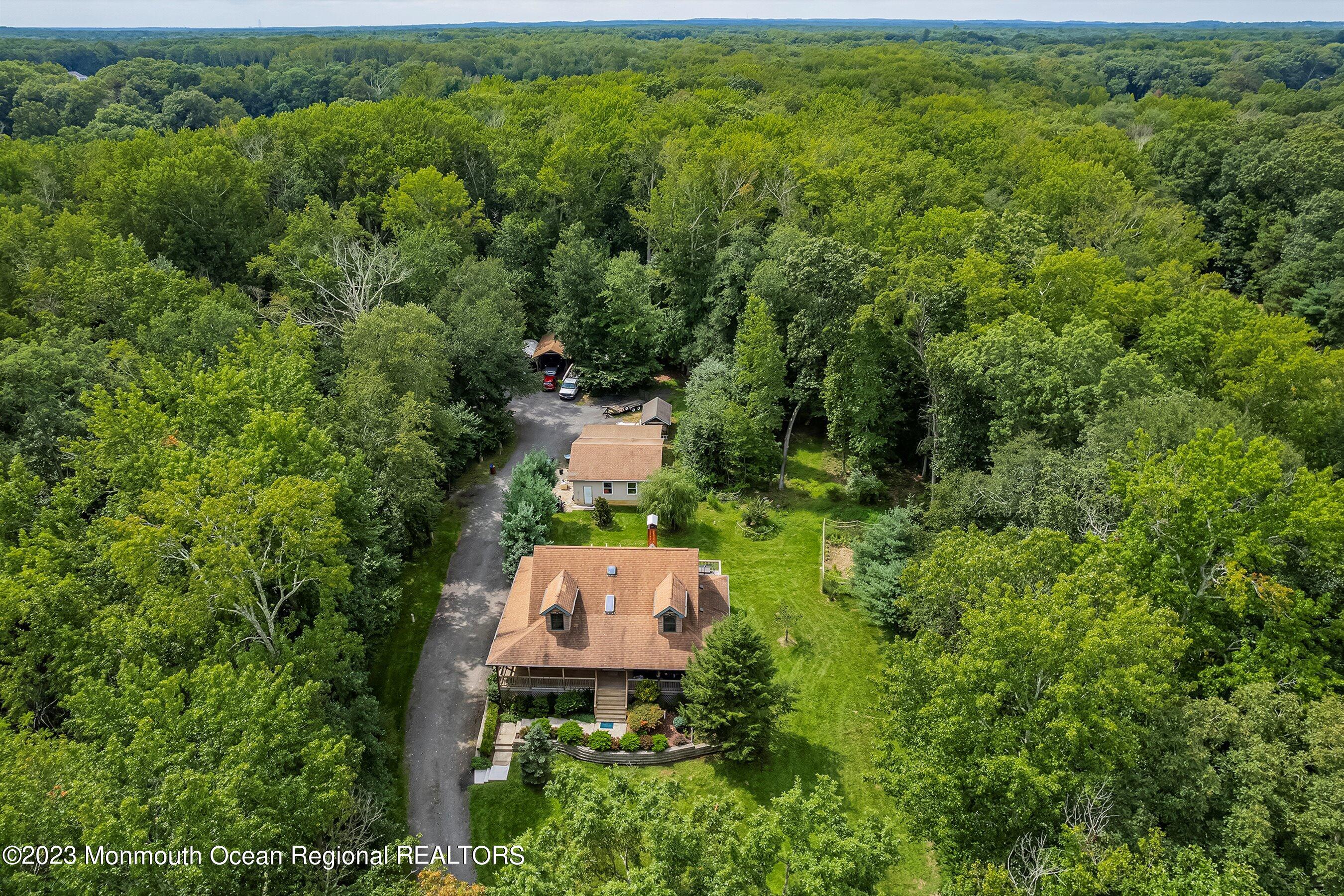 172 Jackson Mills Road Freehold, NJ 07728 - Photo 2 of 20 an aerial view of a house with a yard