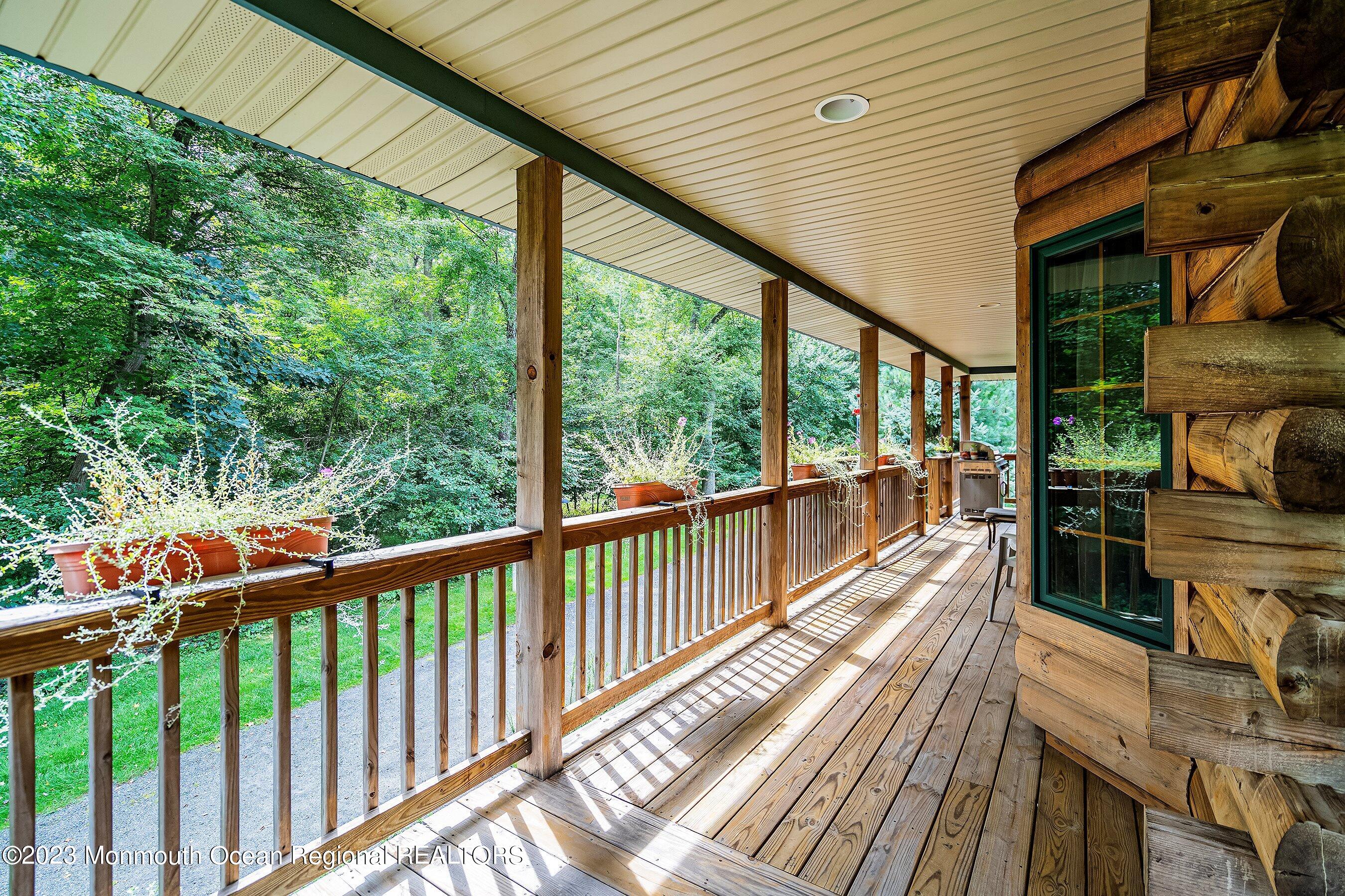 172 Jackson Mills Road Freehold, NJ 07728 - Photo 4 of 20 a view of a balcony with furniture and wooden floor