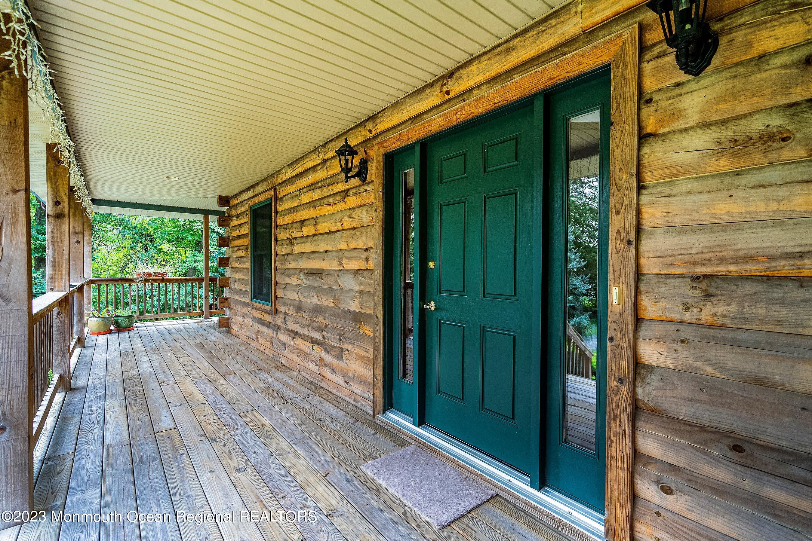 172 Jackson Mills Road Freehold, NJ 07728 - Photo 5 of 20 a view of a porch with wooden floor and outdoor space