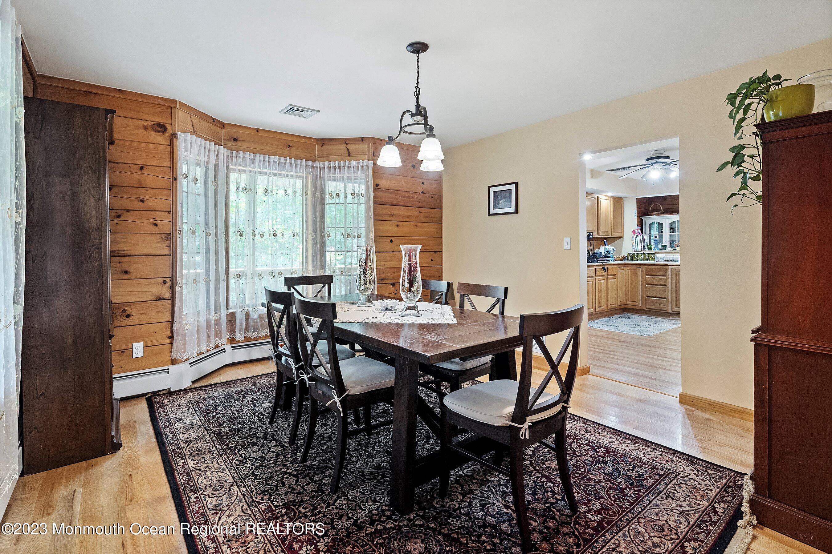172 Jackson Mills Road Freehold, NJ 07728 - Photo 8 of 20 a view of a dining room with furniture window and wooden floor