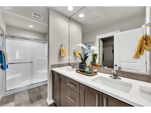 a bathroom with a toilet a sink and a shower