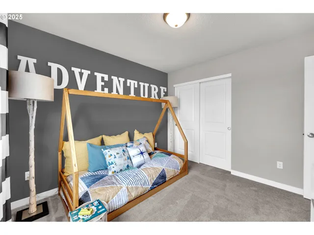 a bathroom with a sink a toilet a mirror and shower curtain