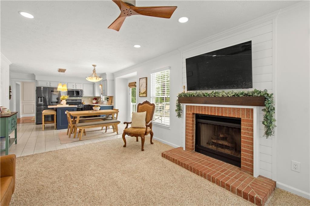 602 Birch Court Bridgeville, PA 15017 - Photo 11 of 47 a living room with furniture a flat screen tv and a fireplace