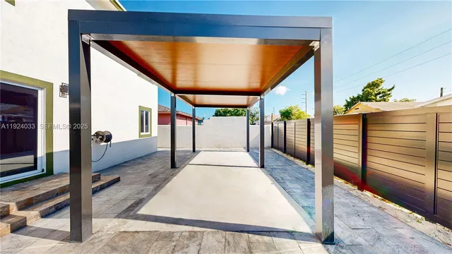 a view of living room kitchen and entryway