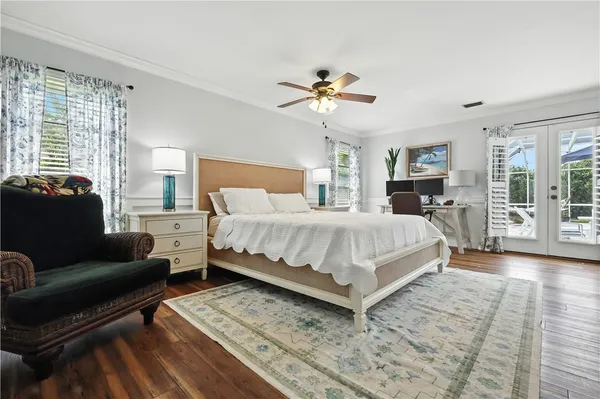 a bedroom with a bed couch and a window