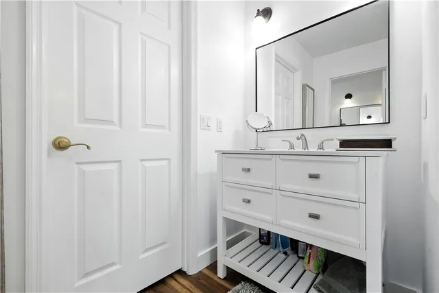 a bathroom with a sink and a mirror