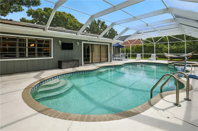 a view of a house with swimming pool