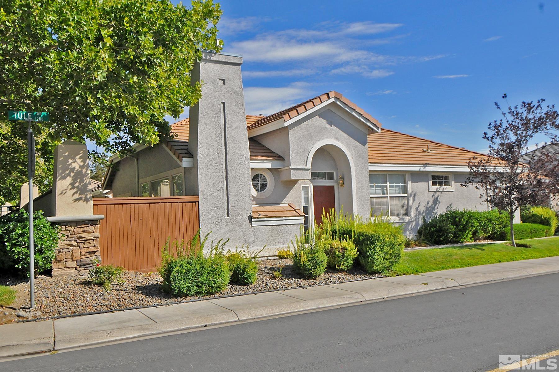 1201 Tule Drive Reno, NV 89521 - Photo 3 of 33 a front view of a house with garden