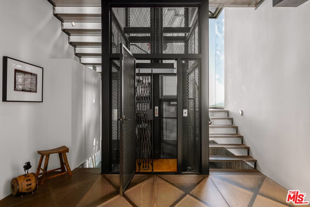 2238 Stradella Road Los Angeles, CA 90077 - Photo 14 of 54 a view of entryway with a door and wooden floor