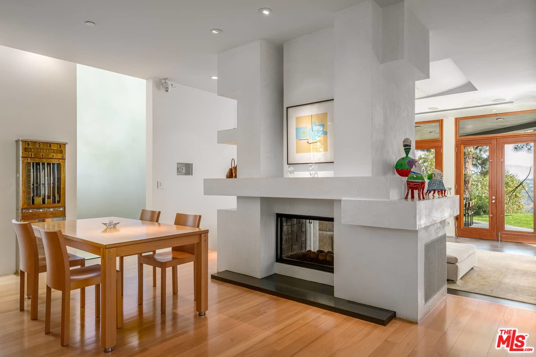 2238 Stradella Road Los Angeles, CA 90077 - Photo 15 of 54 a living room with furniture and a fireplace