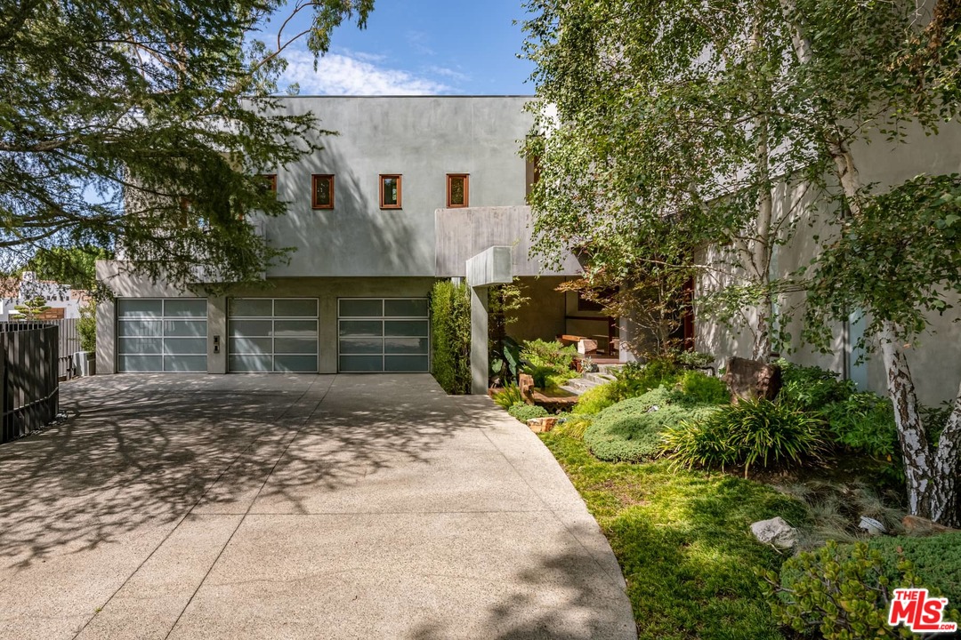 2238 Stradella Road Los Angeles, CA 90077 - Photo 3 of 54 a front view of a house with a yard