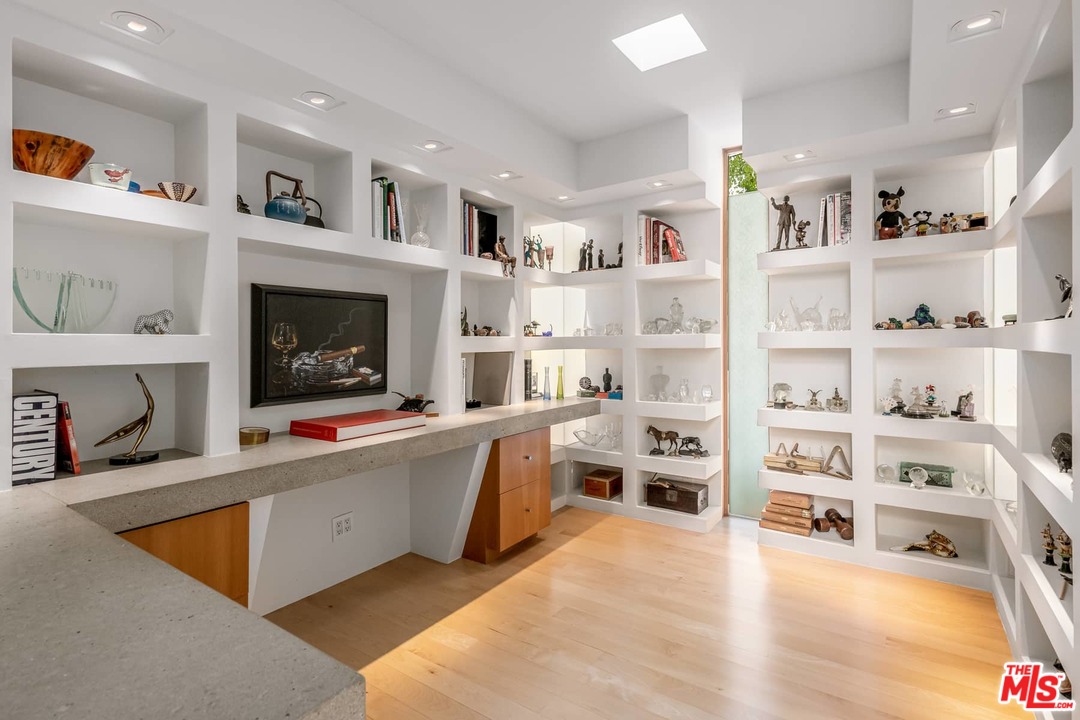 2238 Stradella Road Los Angeles, CA 90077 - Photo 22 of 54 a living room with furniture and a fireplace