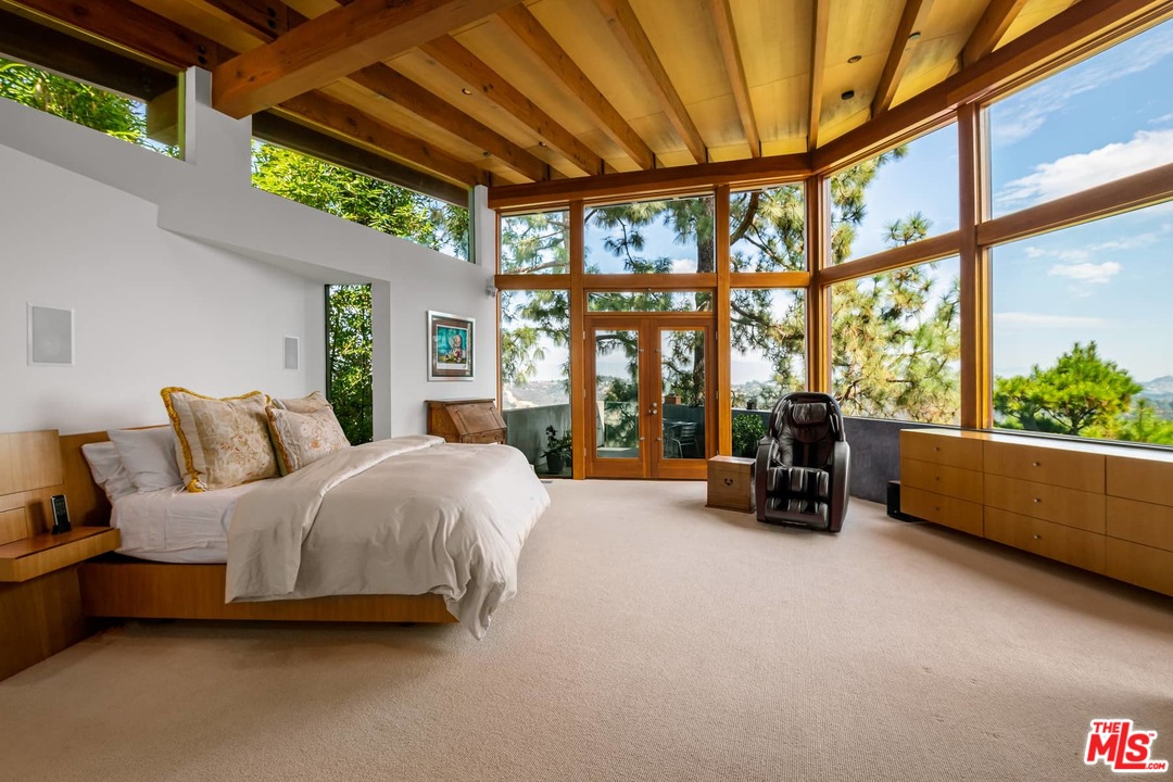 2238 Stradella Road Los Angeles, CA 90077 - Photo 33 of 54 a bedroom with furniture and large windows