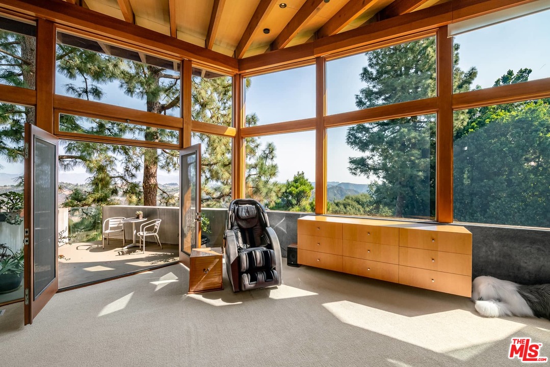 2238 Stradella Road Los Angeles, CA 90077 - Photo 34 of 54 a view of a room with gym equipment and floor to ceiling window