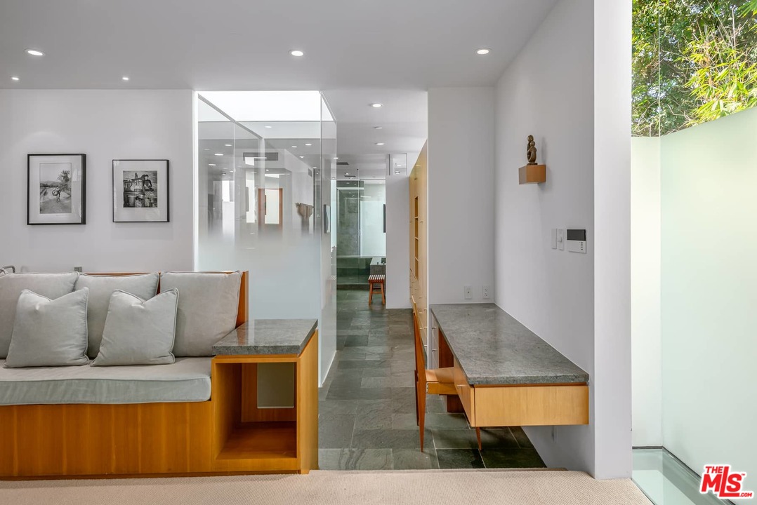 2238 Stradella Road Los Angeles, CA 90077 - Photo 37 of 54 a living room with furniture and a rug