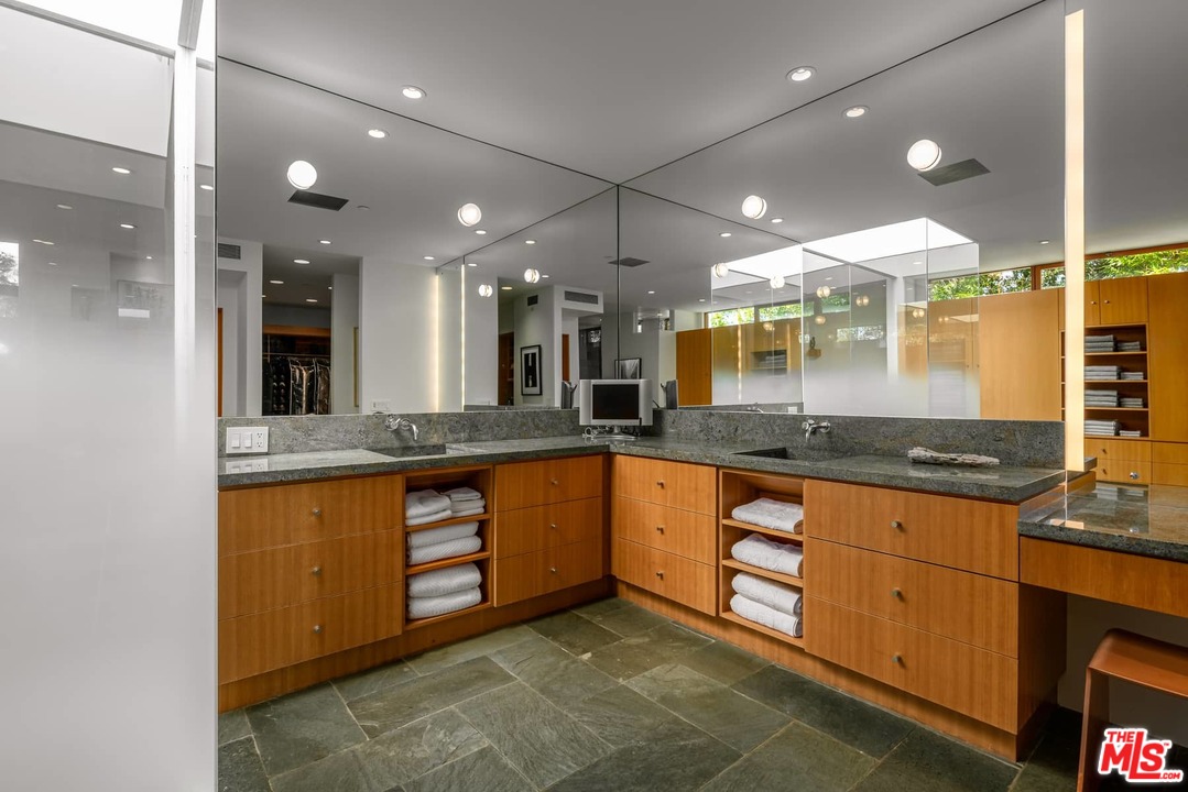 2238 Stradella Road Los Angeles, CA 90077 - Photo 38 of 54 a large kitchen with stainless steel appliances granite countertop a large kitchen island and a sink