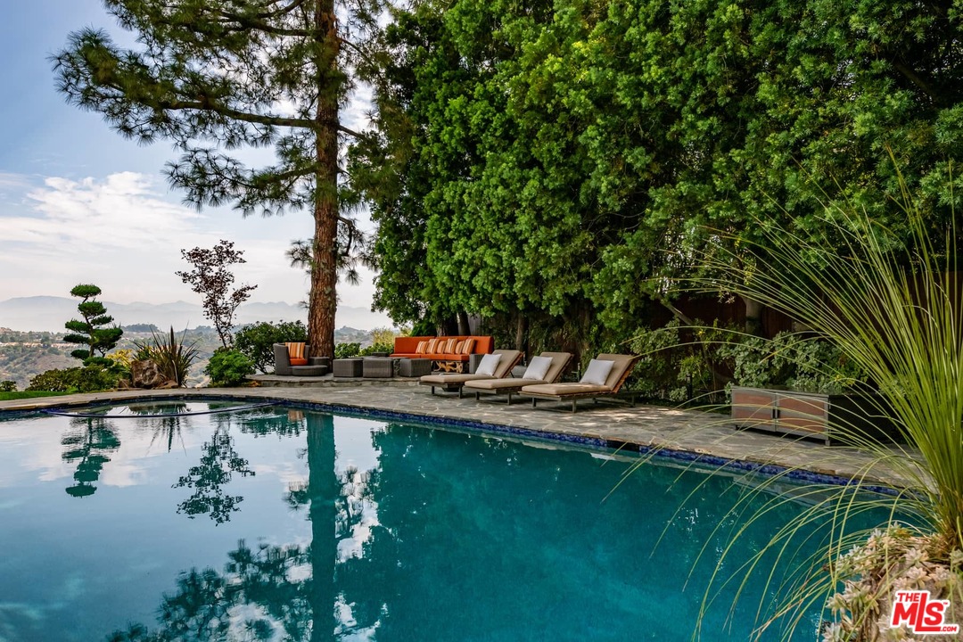 2238 Stradella Road Los Angeles, CA 90077 - Photo 48 of 54 a backyard of a house with lots of green space and lake view