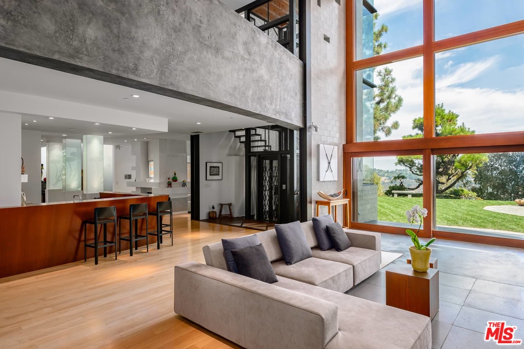 2238 Stradella Road Los Angeles, CA 90077 - Photo 8 of 54 a living room with furniture and a large window