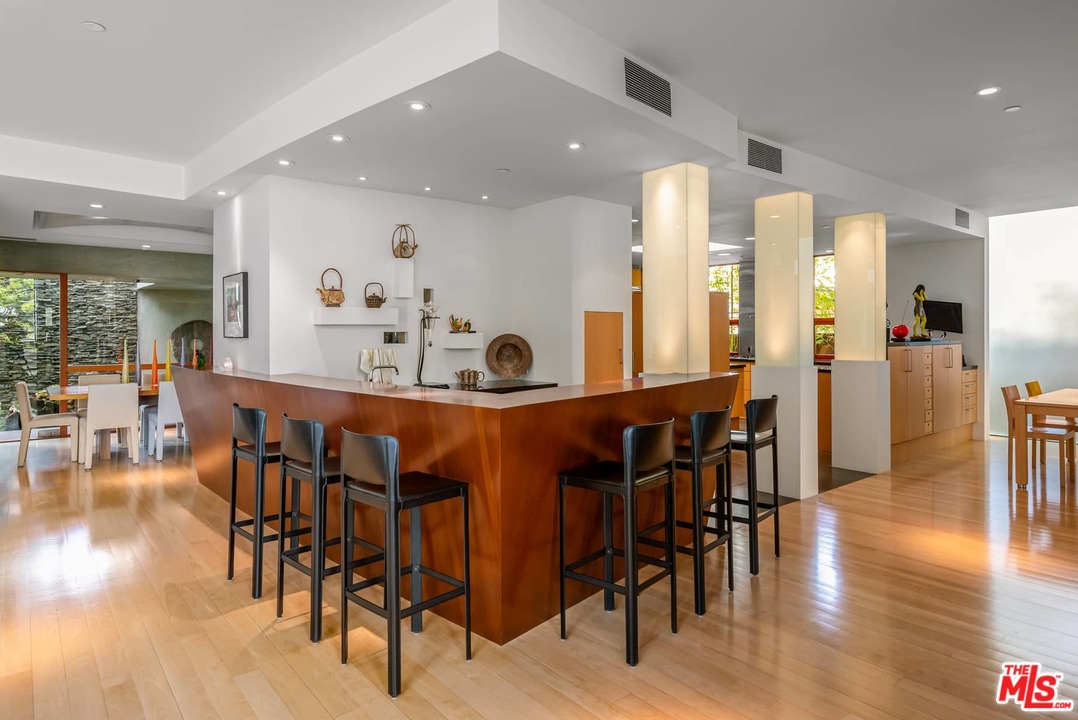 2238 Stradella Road Los Angeles, CA 90077 - Photo 10 of 54 a dining area with furniture and wooden floor