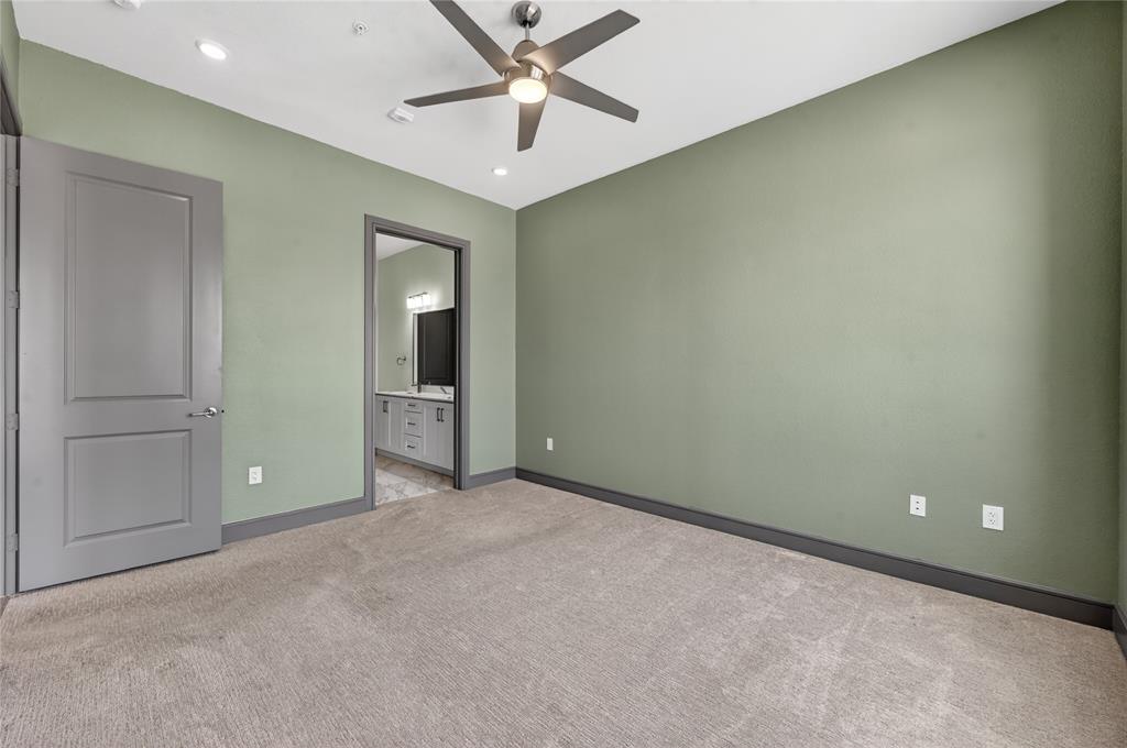 2700 Old Denton Road, Unit 2259 Carrollton, TX 75007 - Photo 21 of 39 an empty room with closet and a chandelier fan