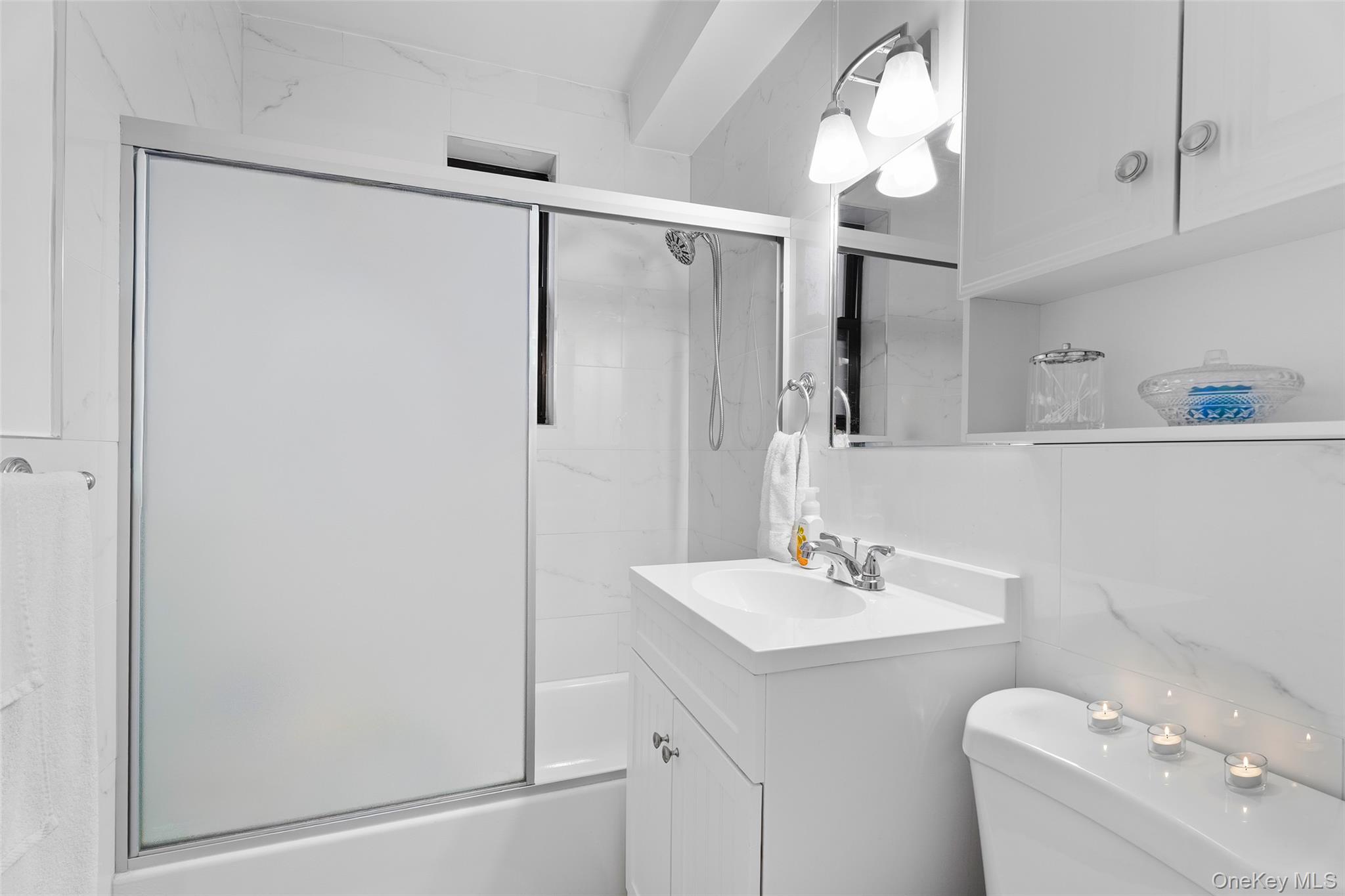 9040 Fort Hamilton Parkway, Unit 3 Brooklyn, NY 11209 - Photo 7 of 11 Full bathroom with vanity and combined bath / shower with glass door