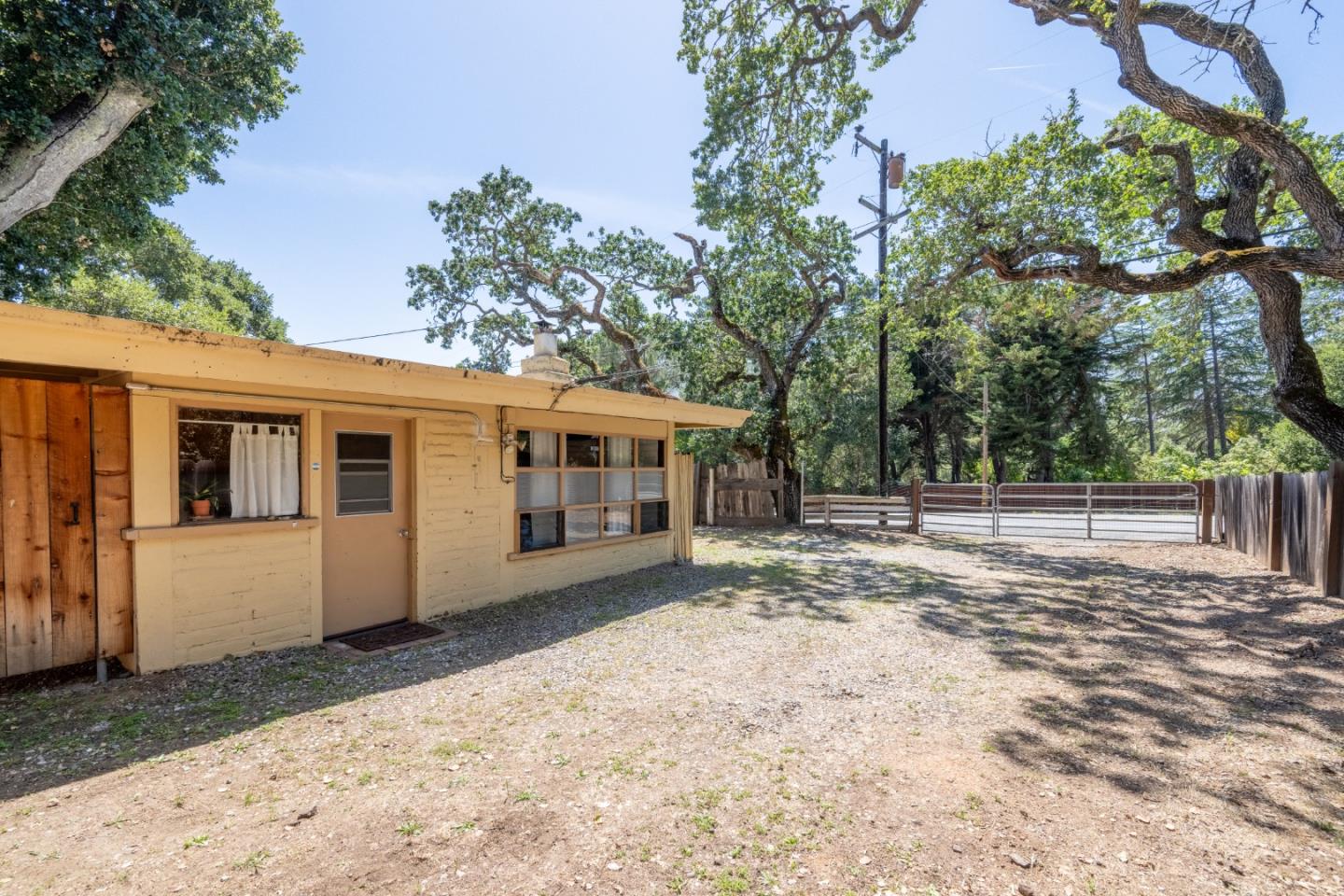 72 Los Laureles Grade Road Carmel Valley, CA 93924 - Photo 32 of 43 a front view of a house with a yard