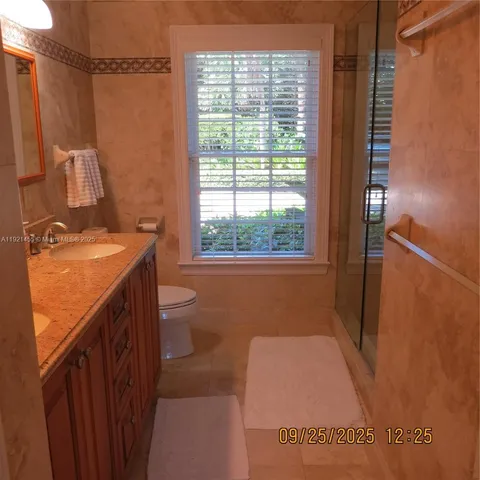 a bathroom with a sink a toilet and tub
