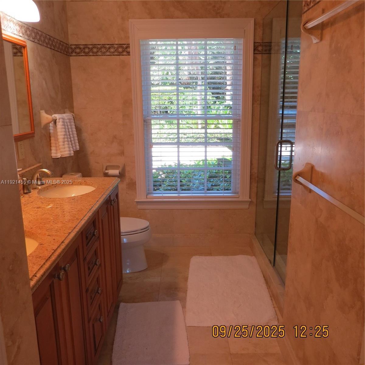 404 South Beach Road, Unit 404 Jupiter Island, FL 33455 - Photo 12 of 23 a bathroom with a sink a toilet and tub