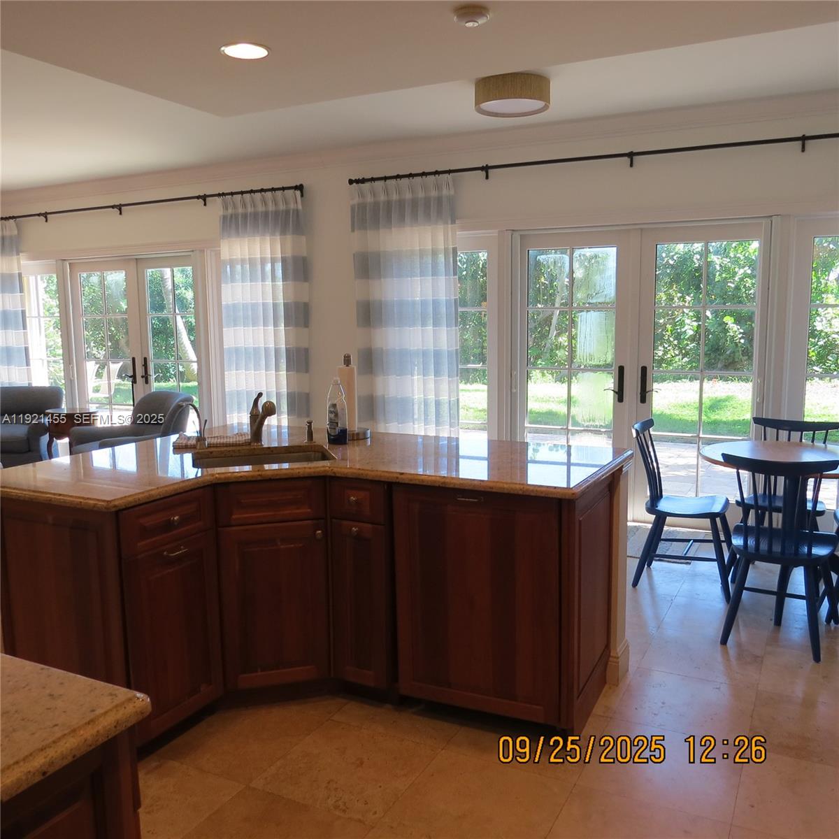 404 South Beach Road, Unit 404 Jupiter Island, FL 33455 - Photo 15 of 23 a kitchen with a large window