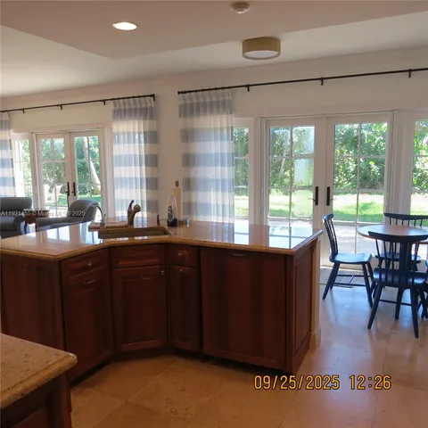 a kitchen with a large window