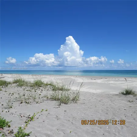 a view of a lake with beach