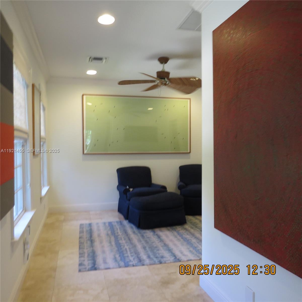 404 South Beach Road, Unit 404 Jupiter Island, FL 33455 - Photo 20 of 23 a living room with furniture and a flat screen tv