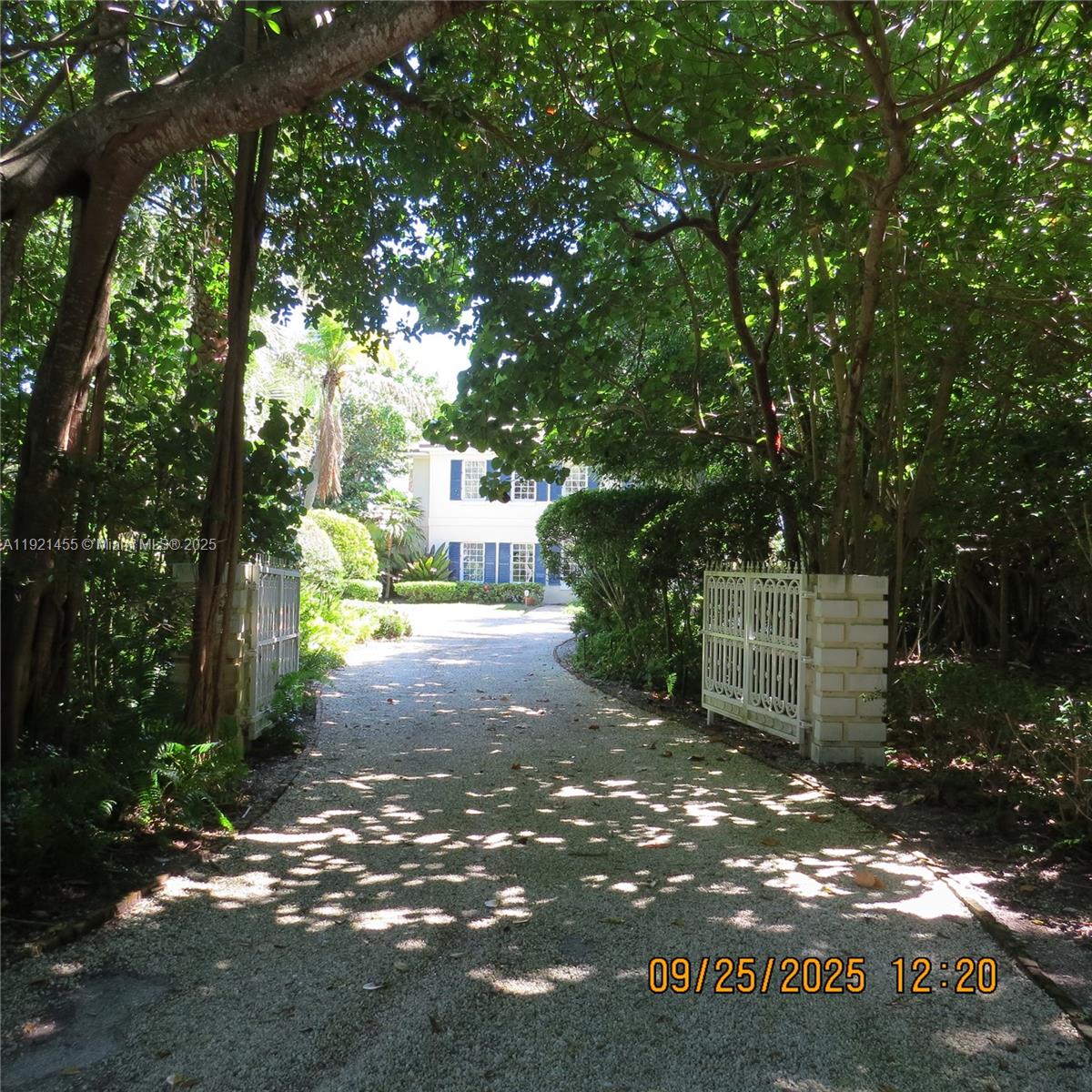 404 South Beach Road, Unit 404 Jupiter Island, FL 33455 - Photo 2 of 23 a view of a street with trees and bushes