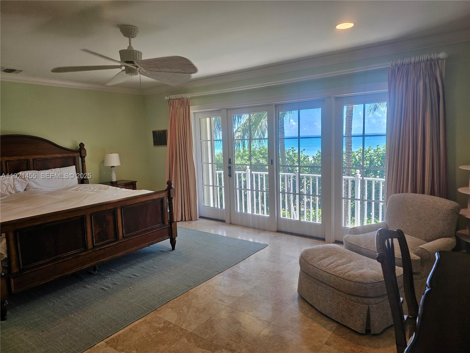 404 South Beach Road, Unit 404 Jupiter Island, FL 33455 - Photo 22 of 23 a living room with furniture and a window