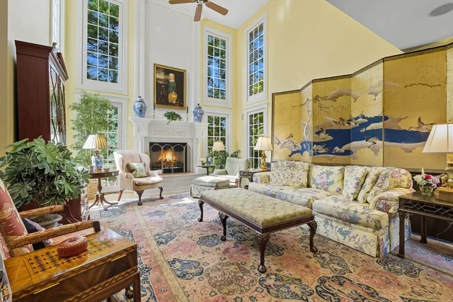 a outdoor living space with furniture and a fireplace