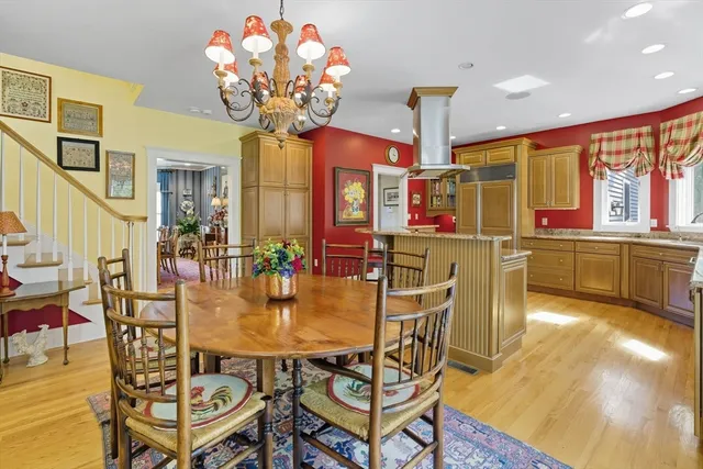 a dining room with furniture and chandelier