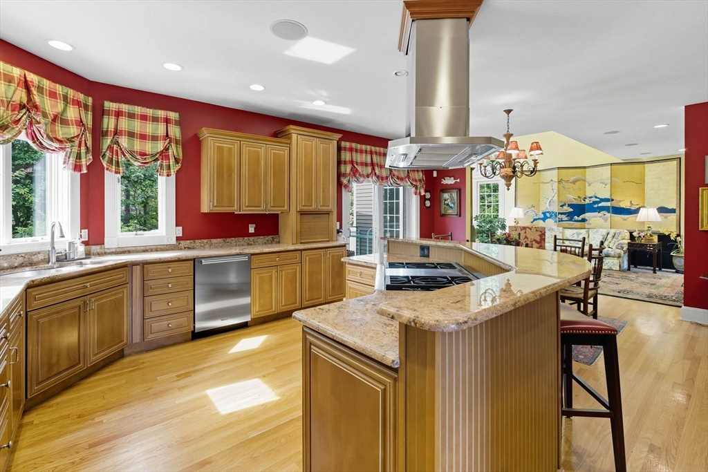 3 Warren Drive Middleton, MA 01949 - Photo 14 of 42 a kitchen with stainless steel appliances granite countertop sink stove and refrigerator
