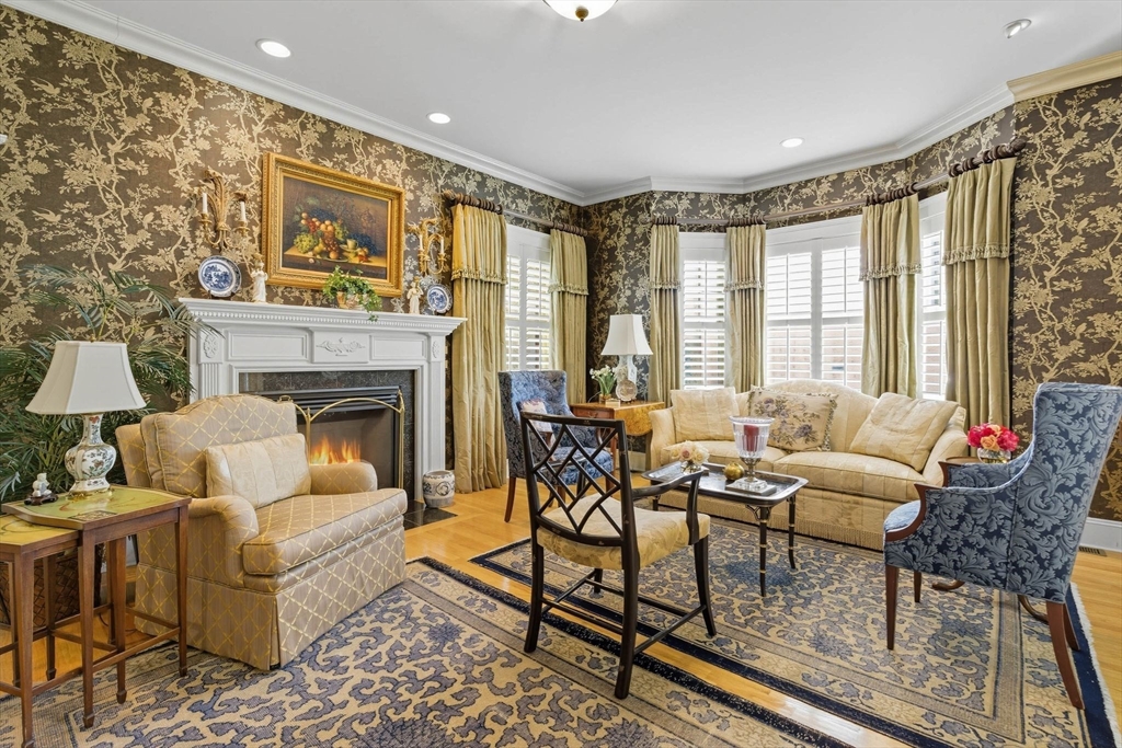 3 Warren Drive Middleton, MA 01949 - Photo 17 of 42 a living room with furniture and a fireplace