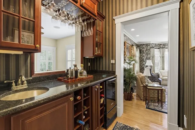 a kitchen with stainless steel appliances granite countertop a sink stove and cabinets