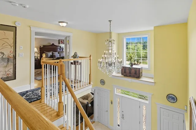 a view of a living room with furniture and window