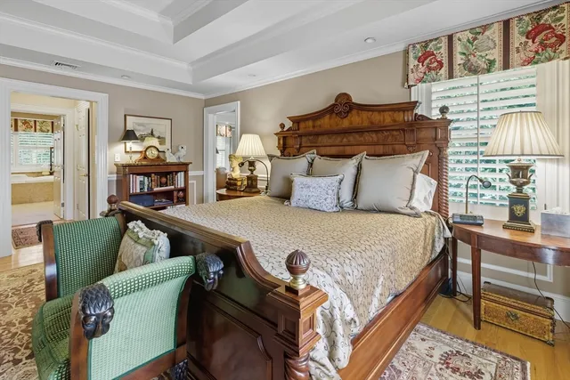 a bedroom with furniture and a wooden floor
