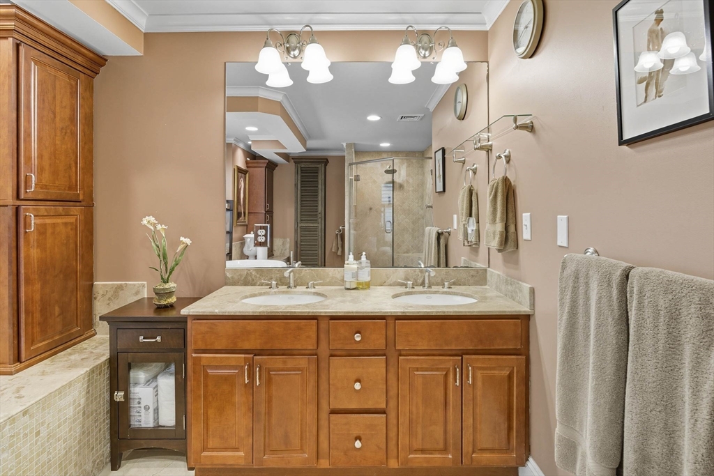 3 Warren Drive Middleton, MA 01949 - Photo 27 of 42 a bathroom with a granite countertop sink a vanity and a large mirror